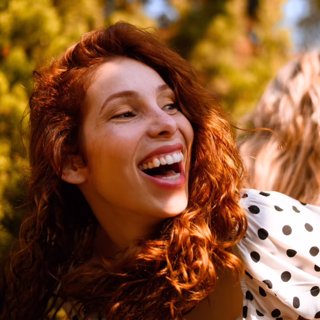 A happy woman enjoying the benefits of aftercare