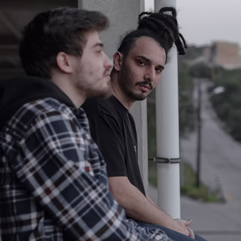 A man deciding with his friend to go to individual therapy