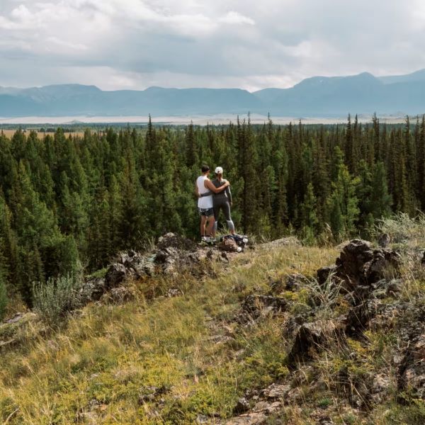 Two people hiking together as part of their addiction recovery journey